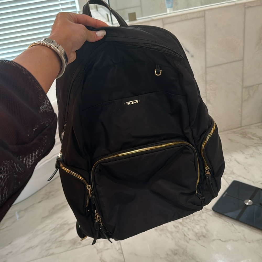 Black tumi backpack! Worn but has a lot of life left!